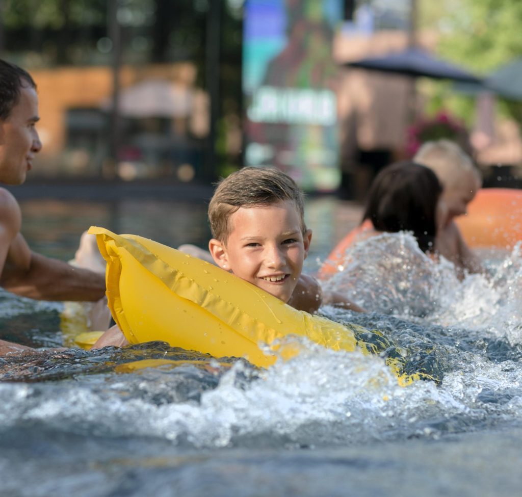 father-enjoying-day-with-his-kids-swimming-pool